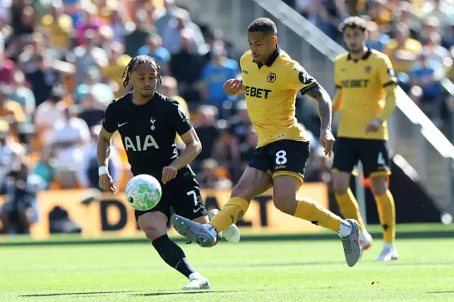 Tottenham Hotspur's Dutch midfielder #07 Xavi Simons (L) vies with Wolverhampton Wanderers' Brazilian midfielder #08 Joao Gomes