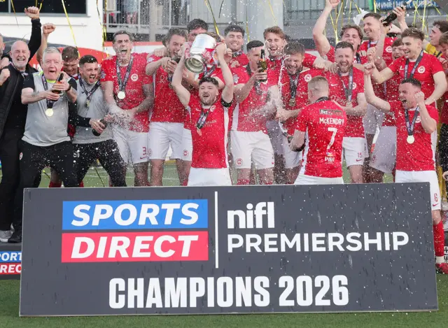Tomas Cosgrove lifts the Irish Premiership title