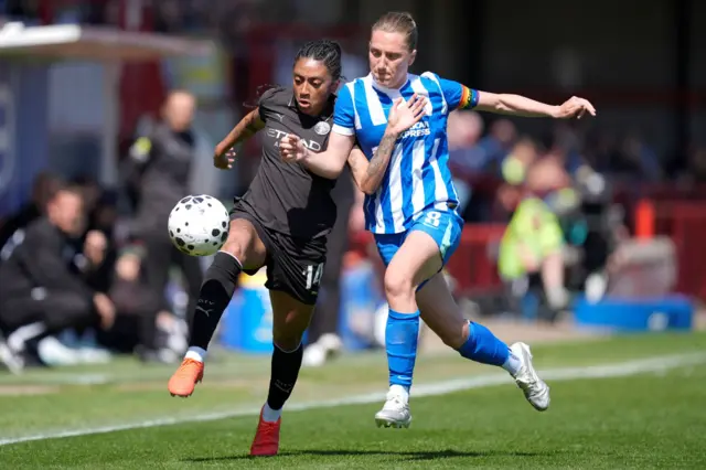 Kerolin chases for the ball
