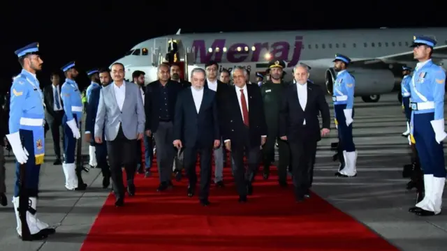 Iranian Foreign Minister Abbas Araghchi (C) walking with Pakistan's Deputy Prime Minister Ishaq Dar (R) and Field Marshal Asim Munir at Nur Khan Airbase in Rawalpindi, Pakistan, 24 April 2026.