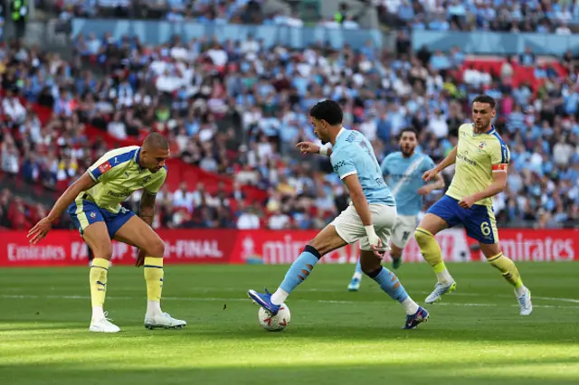 Nathan Wood of Southampton challenges Omar Marmoush