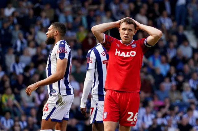 Ipswich's Dara O'Shea holds his head