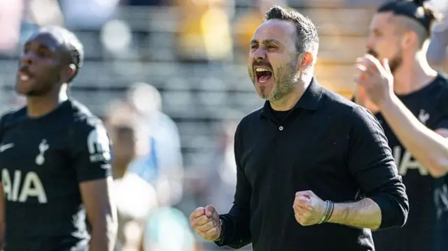 Roberto De Zerbi celebrates Tottenham's win at Wolves, screaming and clenching his fists