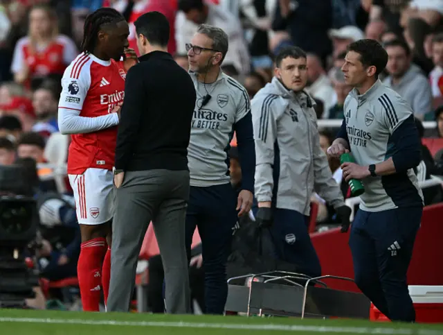 Eberechi Eze talks to Arsenal's manager Mikel Arteta as he leaves the pitch