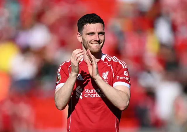 Andrew Robertson of Liverpool applauds the fans following the team's victory