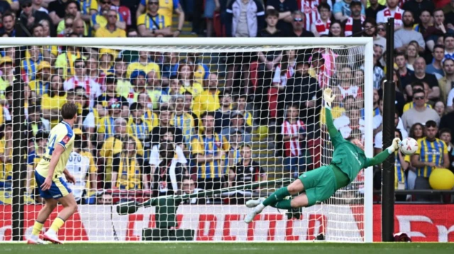 Southampton's Daniel Peretz saves a shot from Manchester City's Tijjani Reijnders