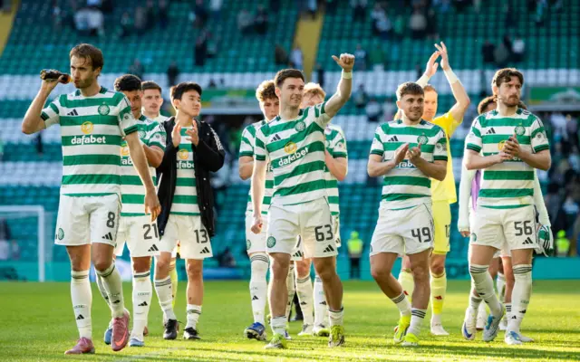Celtic players salute the crowd after their victory