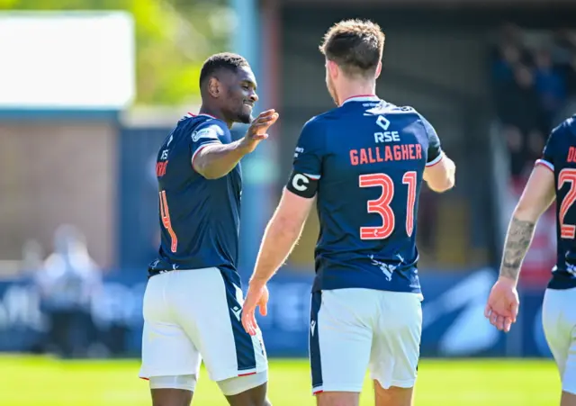 Akil Wright (left) celebrates