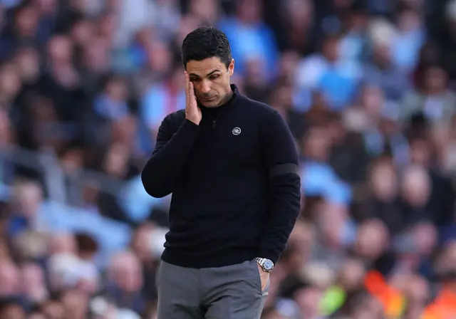 Mikel Arteta looking down