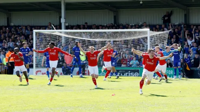 York players celebrate their equaliser at Rochdale