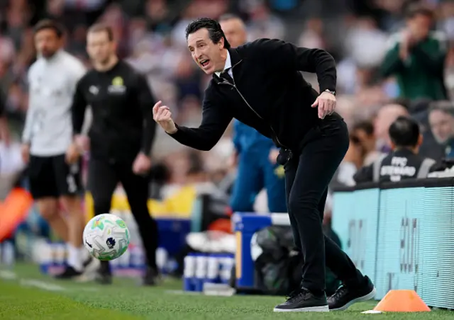 Manager of Aston Villa, throws the ball back into play