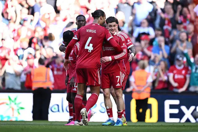 Florian Wirtz of Liverpool celebrates scoring his team's third goal with teammate Virgil van Dijk