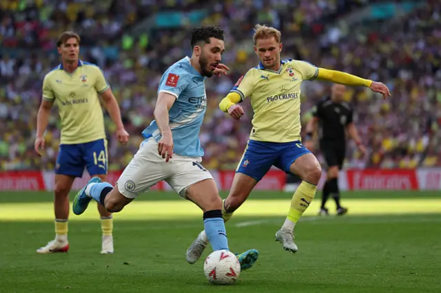 Rayan Cherki runs with the ball