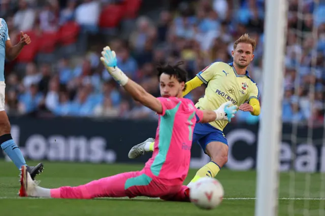 Leo Scienza scores past Manchester City's English goalkeeper James Trafford