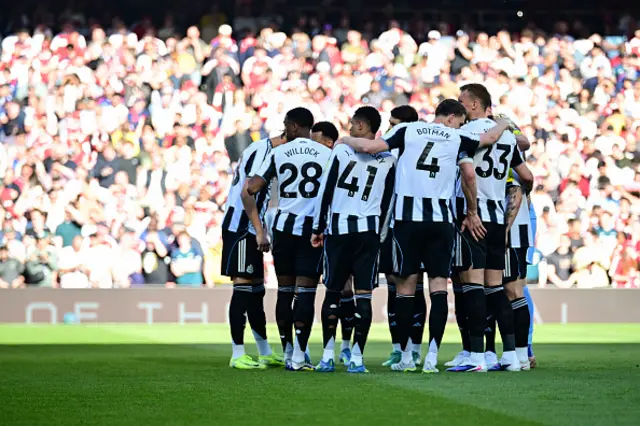 Newcastle players in a huddle