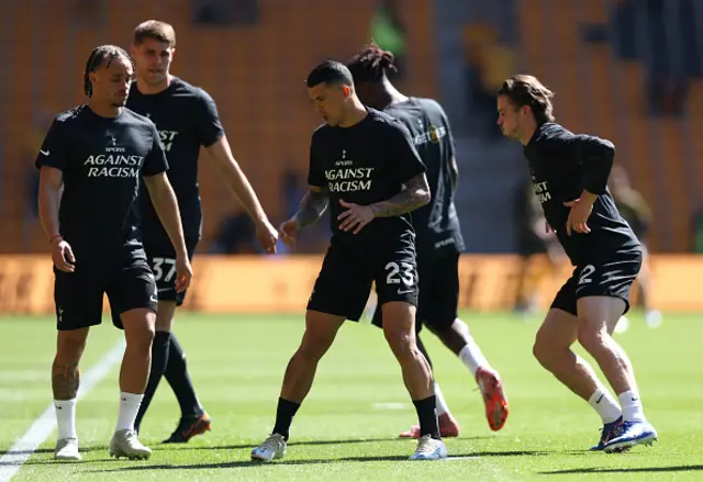 Xavi Simons and Pedro Porro of Tottenham Hotspur warm up with their teammates