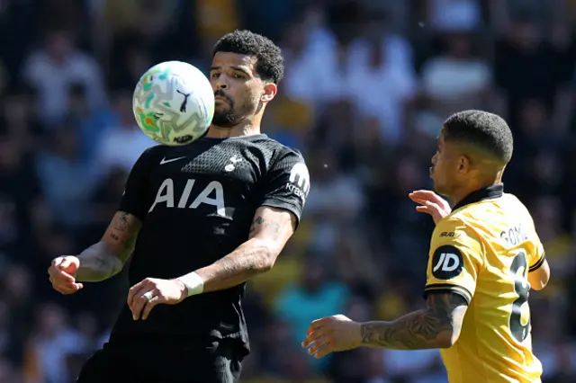 #19 Dominic Solanke (L) vies with Wolverhampton Wanderers' Brazilian midfielder #08 Joao Gomes (R)