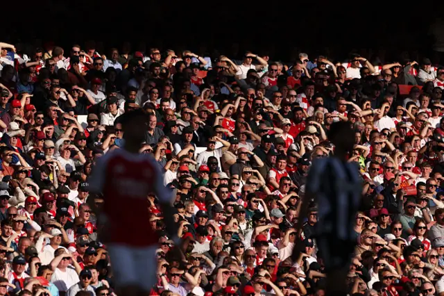 Arsenal fans watch the action