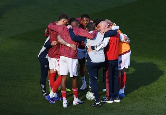 Gabriel Heinze, Coach of Arsenal talks with his team during the warm up