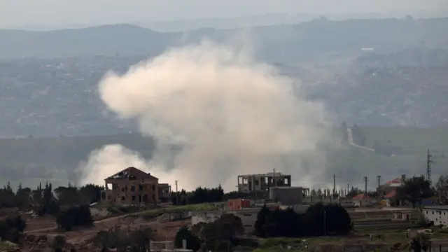 Smoke rises following an explosion in the southern Lebanese village of Taybeh, as seen from the Israeli side of the border in the Upper Galilee, northern Israel, 25 April 2026