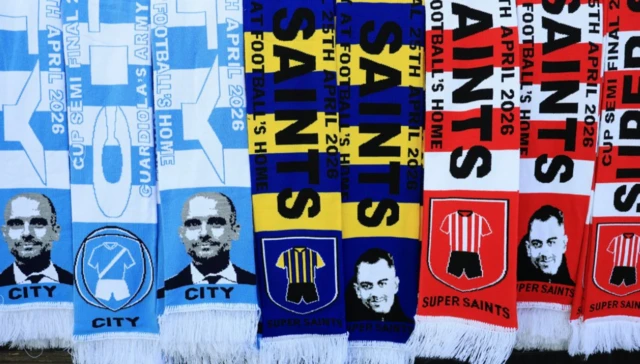 Scarves of Manchester City manager Pep Guardiola and Southampton manager Tonda Eckert on sale outside the stadium