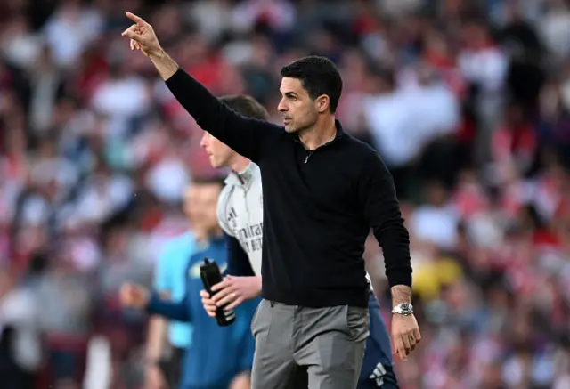Mikel Arteta, Manager of Arsenal, points from the sidelines