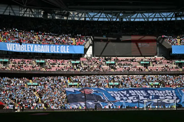 City fans display an Oasis inspired tifo in the crowd