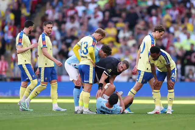 Matheus Nunes of Manchester City reacts with an injury