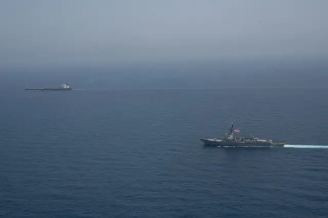 Boat in water with another in the distance