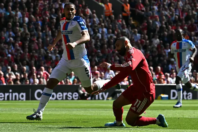 Maxence Lacroix reacts as Liverpool's Egyptian strikerMohamed Salah goes down