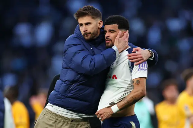 Dominic Solanke being comforted