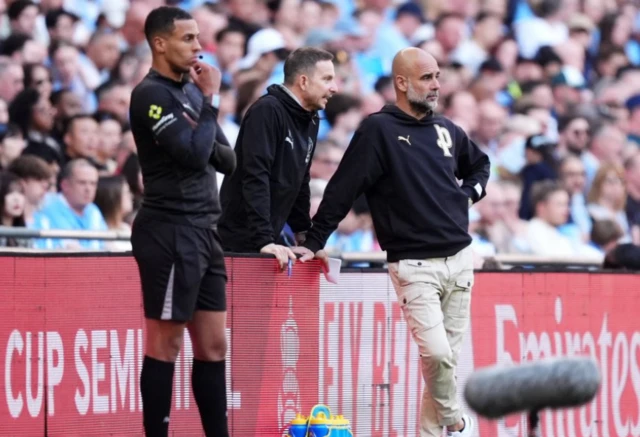 Manchester City manager Pep Guardiola (right) on the touchline