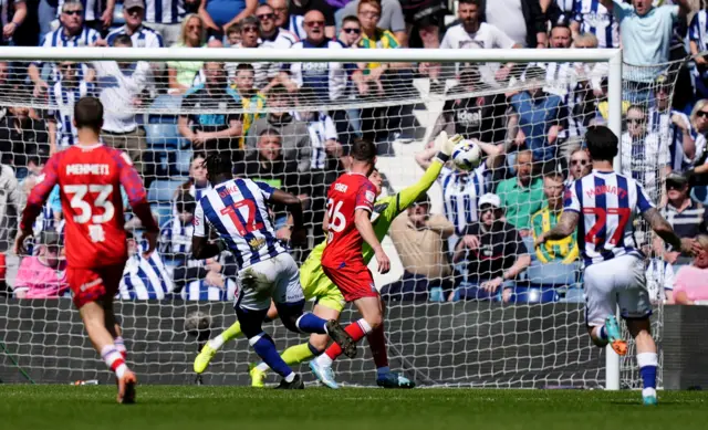 Ipswich goalkeeper Christian Walton saves from West Brom's Daryl Dike