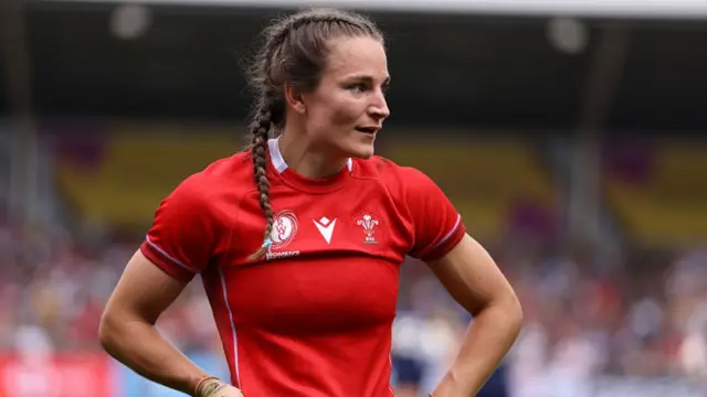 Jasmine Joyce in a red Wales shirt