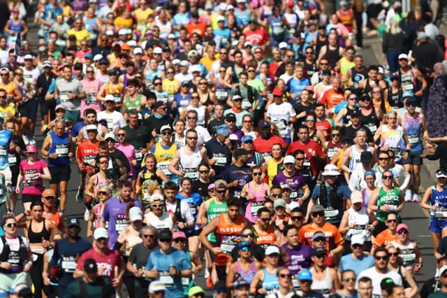 Runners compete around the first mile