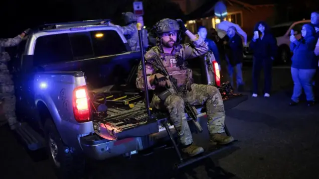 FBI agents leave the residence associated with Cole Tomas Allen, the suspect in the shooting incident at the annual White House Correspondents' Association dinner