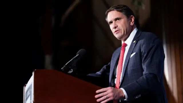 Todd Blanche at a podium