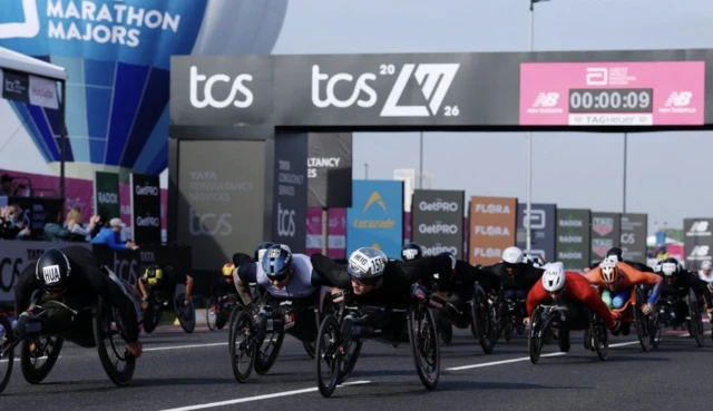 Britain's David Weir, China's Jin Hua and Britain's David Weir at the start of the men's wheelchair race
