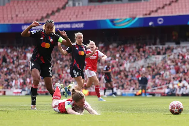 Kim Little of Arsenal is challenged by Wendie Renard