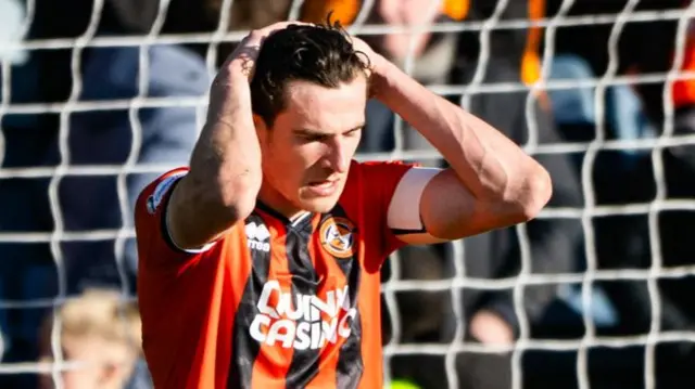 Dundee United captain Ross Graham after knocking in an own goal at Dens Park