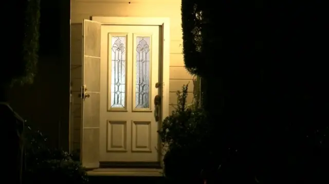 Door of home being searched by US law enforcement