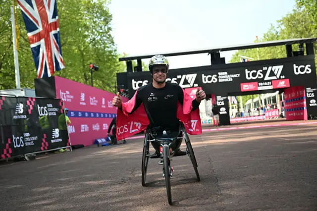 Switzerland's Marcel Hug poses after winning the men's wheelchair race
