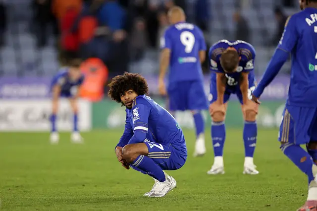 Leicester players slump to the floor after relegation is confirmed