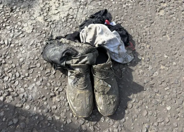 A pile of muddy clothing