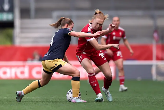 Ceri Holland of Liverpool is challenged by Oona Siren of West Ham United