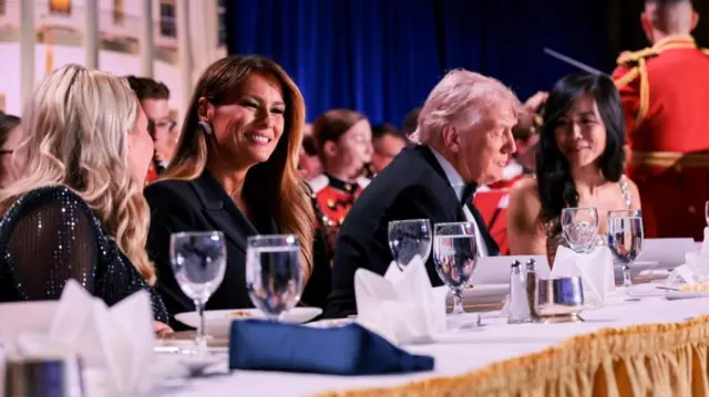 Donald Trump seated next to US First Lady Melania Trump and Weijia Jiang, President of the White House Correspondents' Association