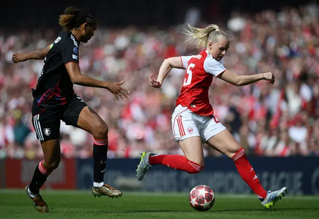 Stina Blackstenius of Arsenal is challenged by Wendie Renard of OL Lyonnes
