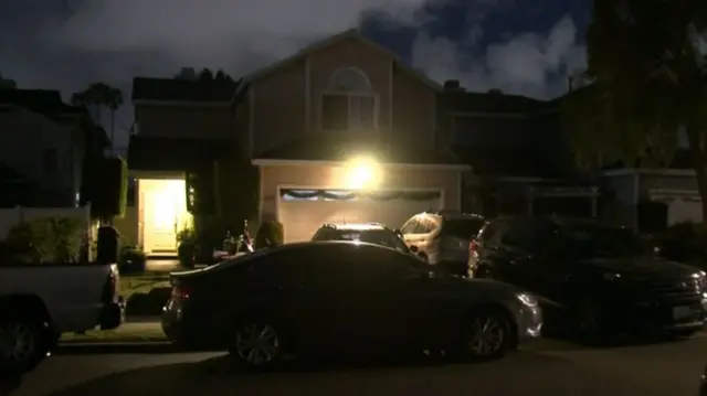 Wide view of home being searched by US law enforcement