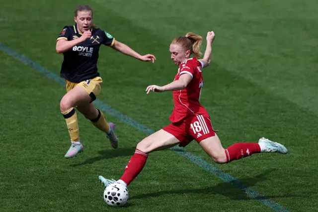 Ceri Holland of Liverpool shoots while under pressure from Oona Siren of West Ham United