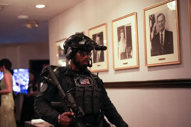 A federal agent patrols after an incident at the annual White House Correspondents Association Dinner